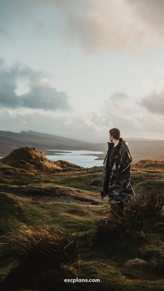Liam stood at a stunning location on the isle of Skye, the old man of Storr. looking out to a beautiful landscape
