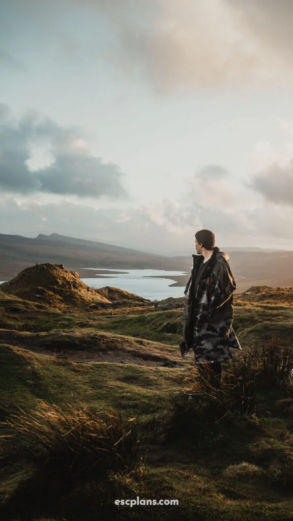 Liam stood at a stunning location on the isle of Skye, the old man of Storr. looking out to a beautiful landscape