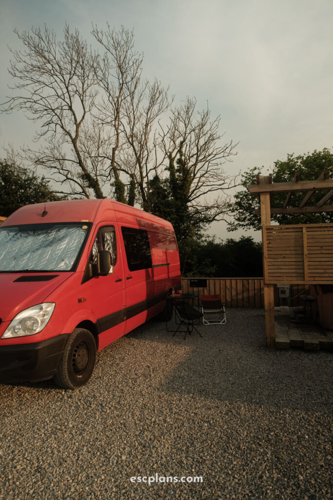 image of a red sprinter van at Kip & Nook